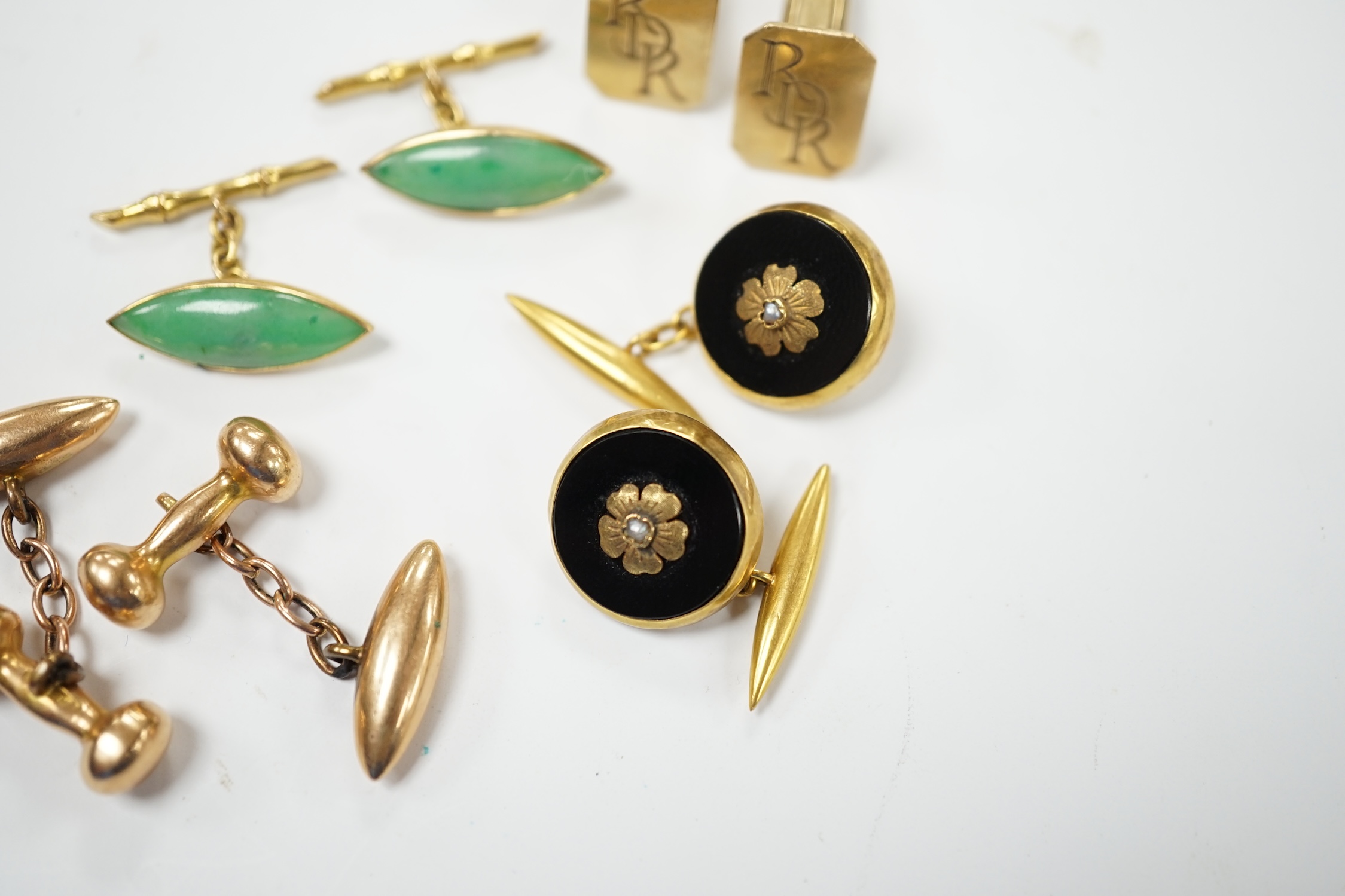 A pair of Edwardian 15ct gold torpedo shaped cufflinks, 9,6 grams and three other pairs of cufflinks including Chinese jade and monogrammed 9ct gold. Fair to good condition.